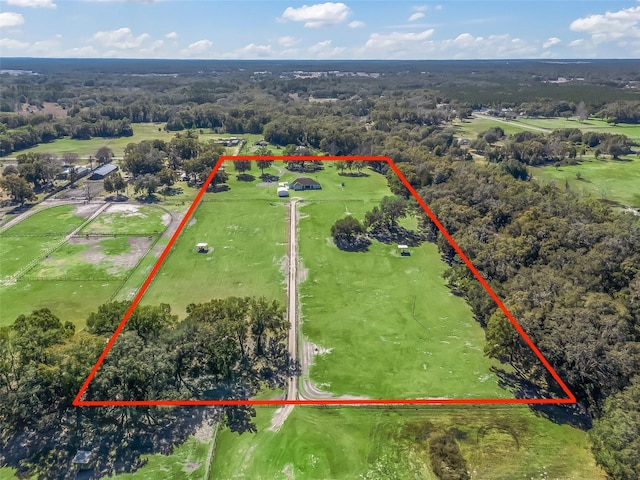 birds eye view of property featuring a rural view