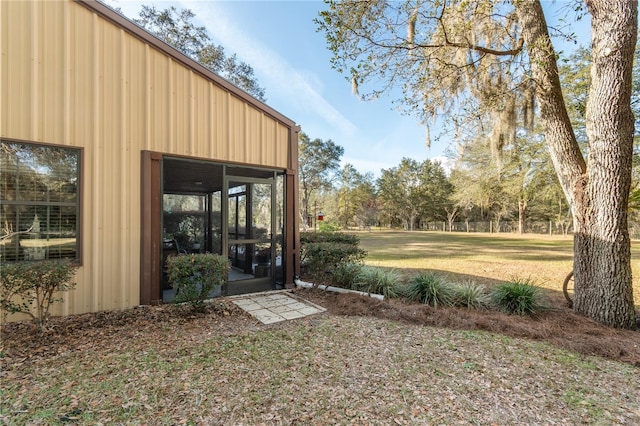 view of yard featuring a sunroom