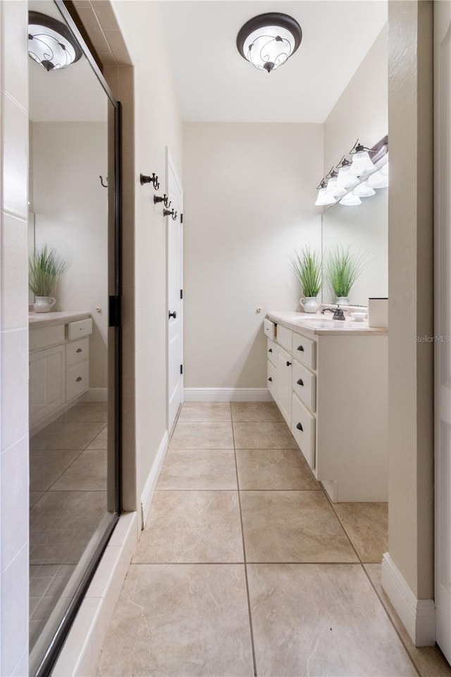 bathroom featuring vanity and tile patterned flooring