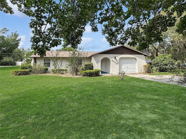 5570 W Cagney Loop, Homosassa, FL 34448 - single story home with a front yard, an attached garage, driveway, and stucco siding