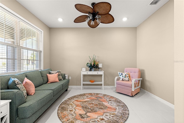 interior space featuring ceiling fan and light tile patterned floors