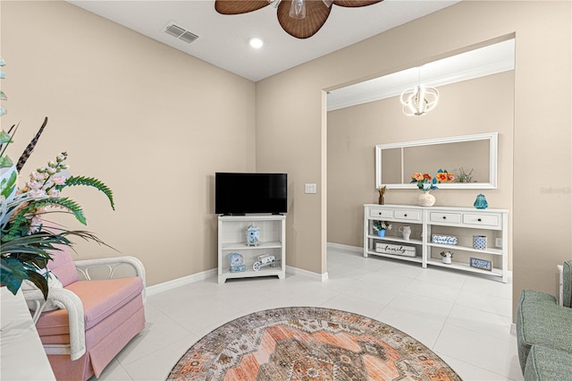 living room with light tile patterned floors and ceiling fan with notable chandelier