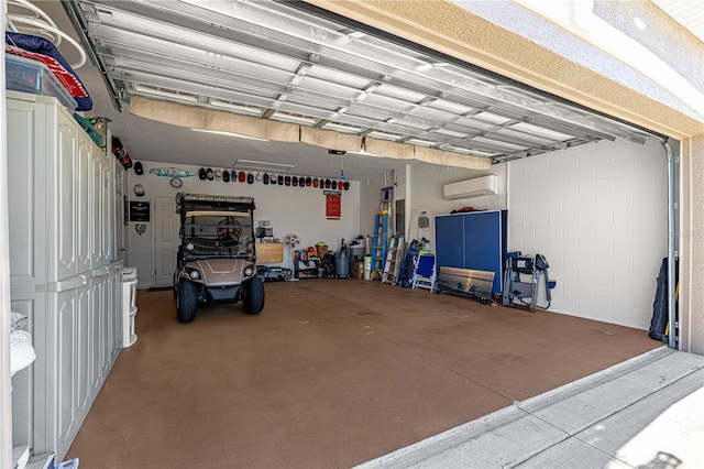 garage featuring a wall mounted air conditioner