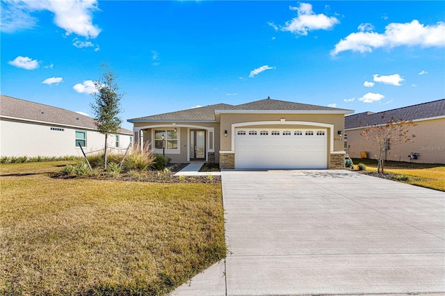 view of front of house featuring a garage and a front yard