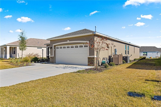 view of front of property featuring a garage and a front yard