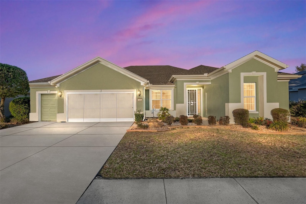 ranch-style home featuring a garage