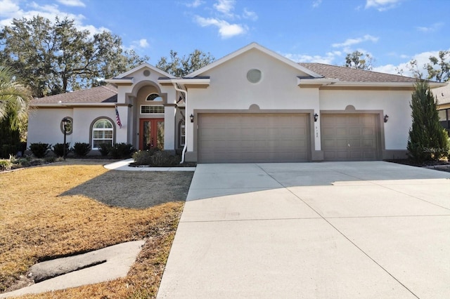 view of front of home with a garage