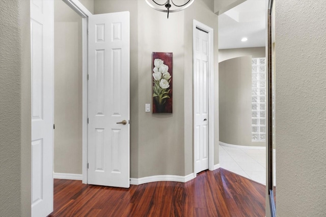 hallway featuring dark hardwood / wood-style flooring