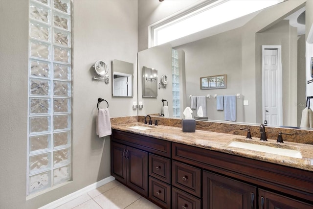 bathroom with tile patterned flooring and vanity