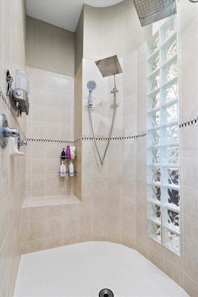 bathroom with tiled shower