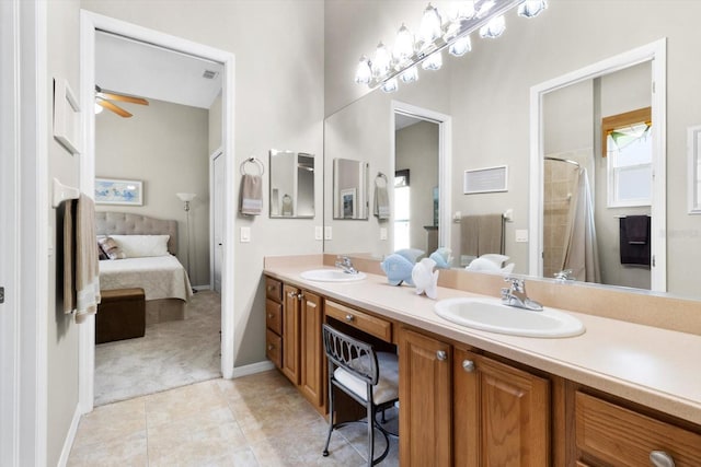 bathroom with a shower with curtain, ceiling fan, vanity, and tile patterned flooring