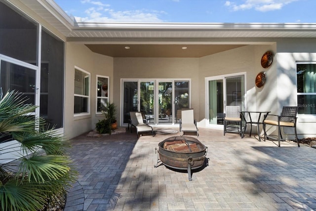 view of patio featuring an outdoor fire pit