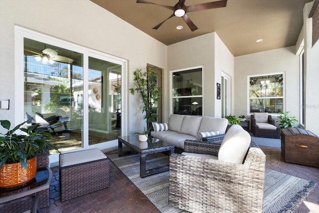 view of patio / terrace with an outdoor living space and ceiling fan