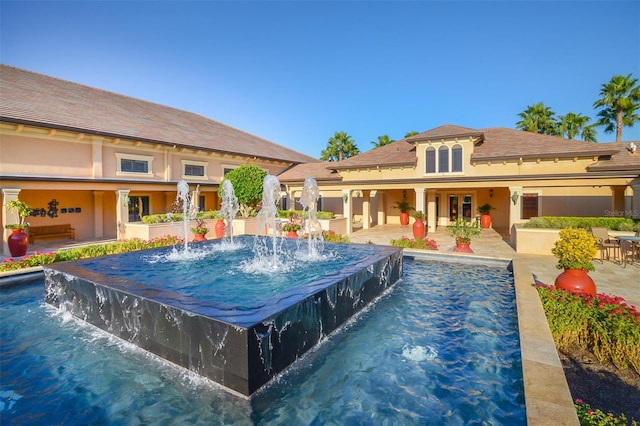 view of pool featuring pool water feature