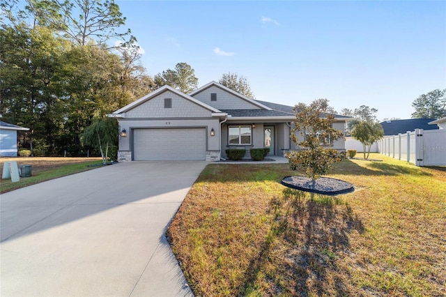 view of front of home with a garage and a front yard