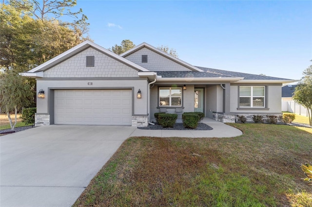 single story home with a garage and a front lawn