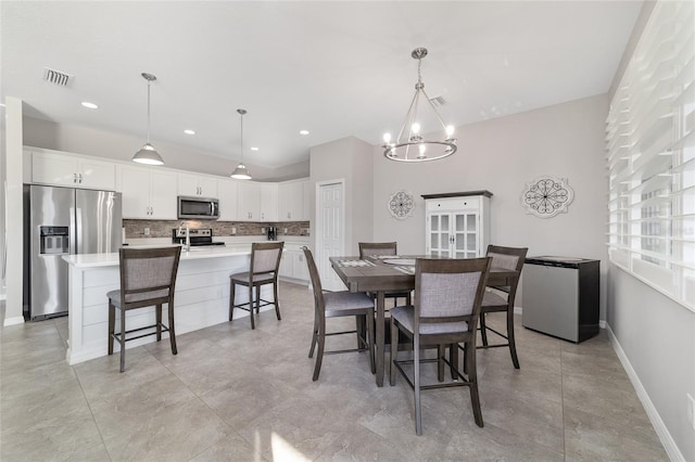 dining area with a notable chandelier