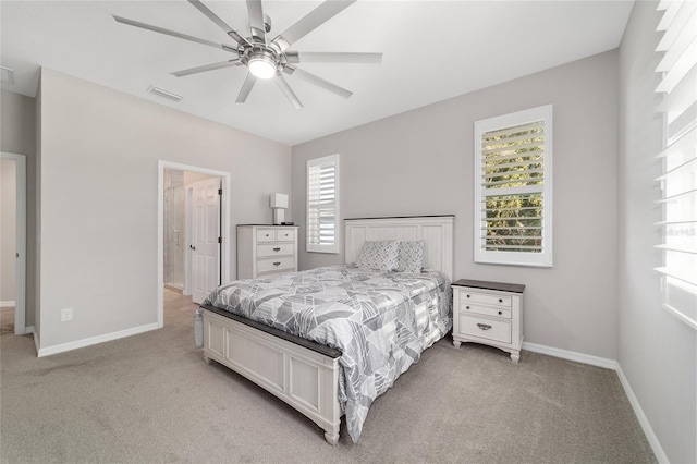 bedroom featuring light carpet and ceiling fan