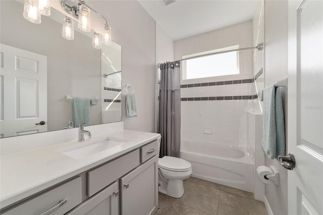 full bathroom with vanity, shower / bath combination with curtain, tile patterned floors, and toilet