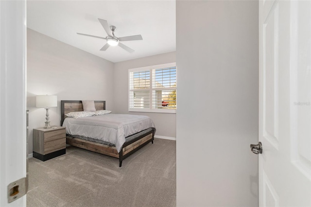 bedroom with light colored carpet and ceiling fan