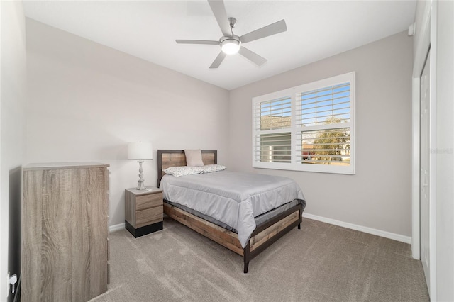 carpeted bedroom featuring ceiling fan