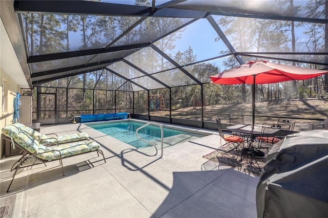 view of pool featuring a lanai and a patio area