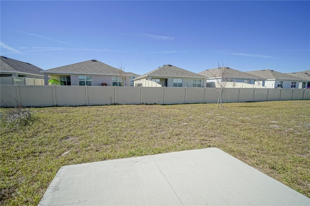 view of yard featuring a patio and fence