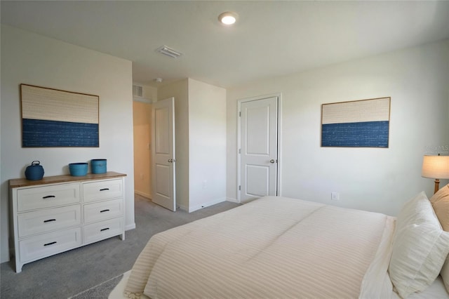 bedroom with baseboards, visible vents, and carpet floors