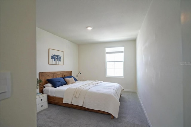 bedroom featuring carpet flooring and baseboards