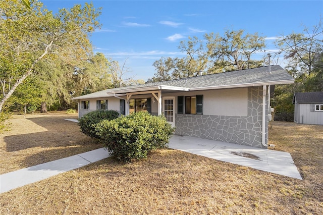 ranch-style house with a shed