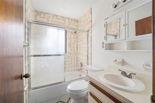 full bathroom with toilet, vanity, shower / bath combination with glass door, and a textured ceiling