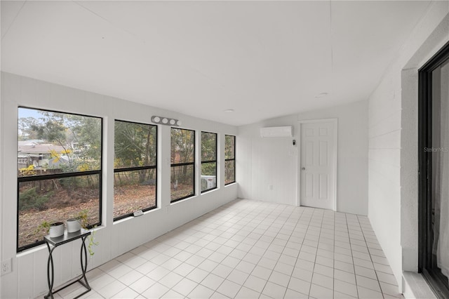 unfurnished sunroom featuring an AC wall unit