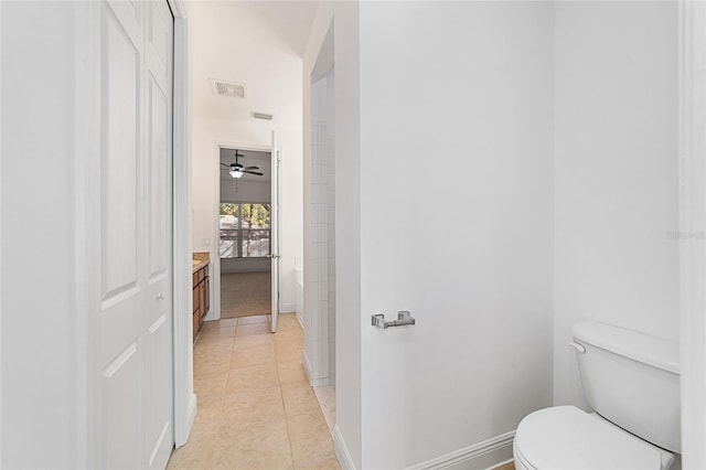 bathroom with tile patterned floors, toilet, and vanity