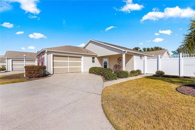 ranch-style home featuring a garage and a front lawn