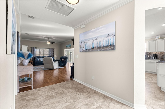 hallway featuring crown molding