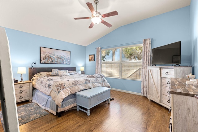 bedroom featuring hardwood / wood-style flooring, vaulted ceiling, and ceiling fan