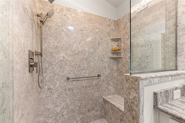 bathroom with tiled shower