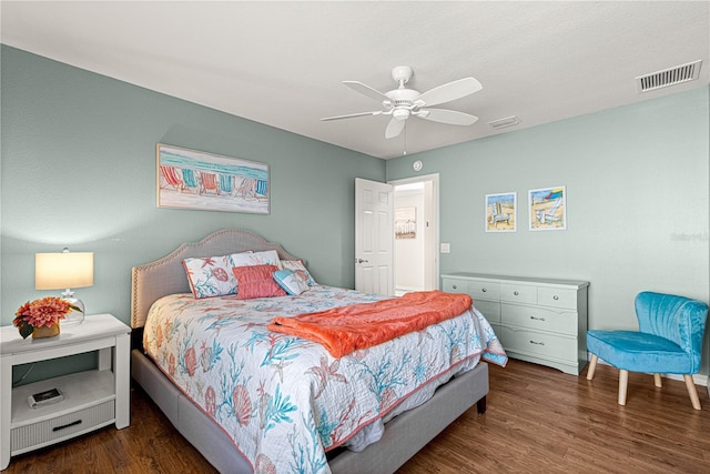 bedroom with dark wood-type flooring and ceiling fan