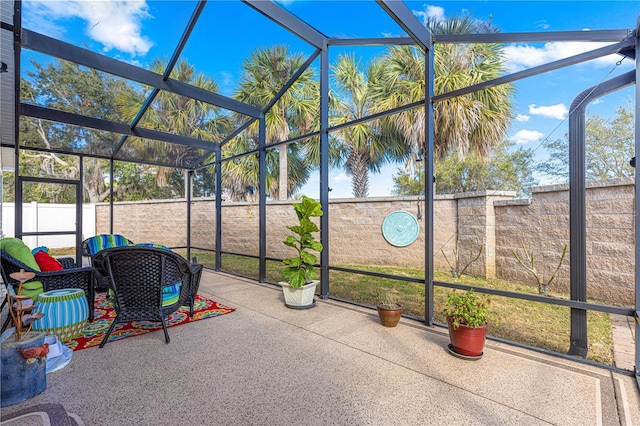 view of patio with glass enclosure