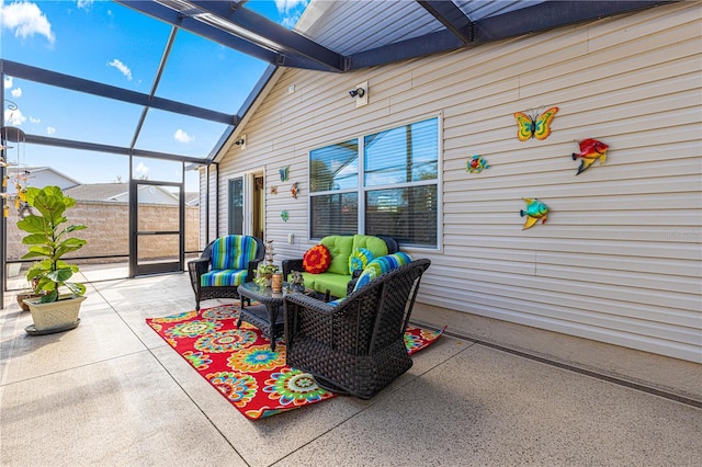 view of patio with an outdoor living space and glass enclosure