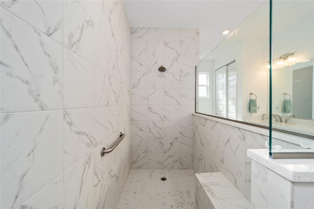 bathroom with a tile shower