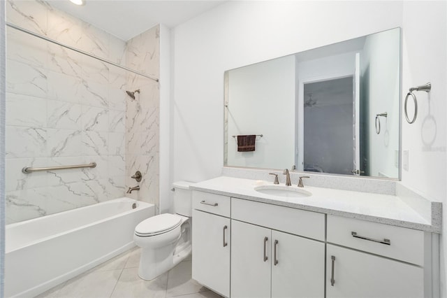 full bathroom featuring tiled shower / bath combo, vanity, tile patterned flooring, and toilet