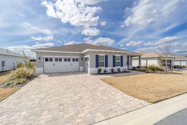 view of front of property with a garage