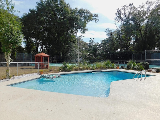 view of swimming pool featuring a gazebo