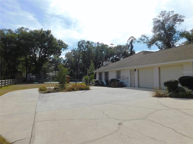 view of side of home with a garage