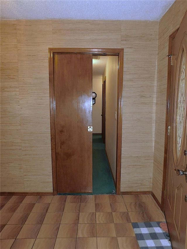 hallway with light tile patterned floors