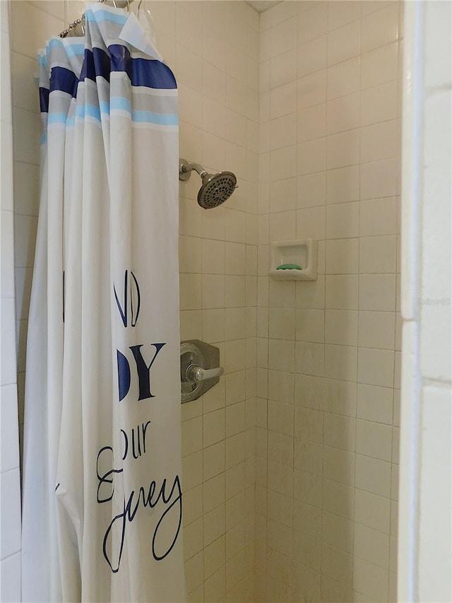 bathroom with a shower with shower curtain