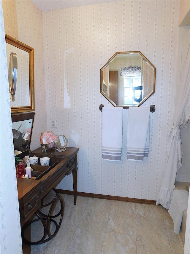 bathroom with tile patterned floors