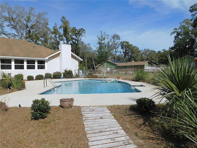 view of pool featuring a patio area