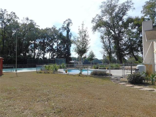 view of yard with a community pool